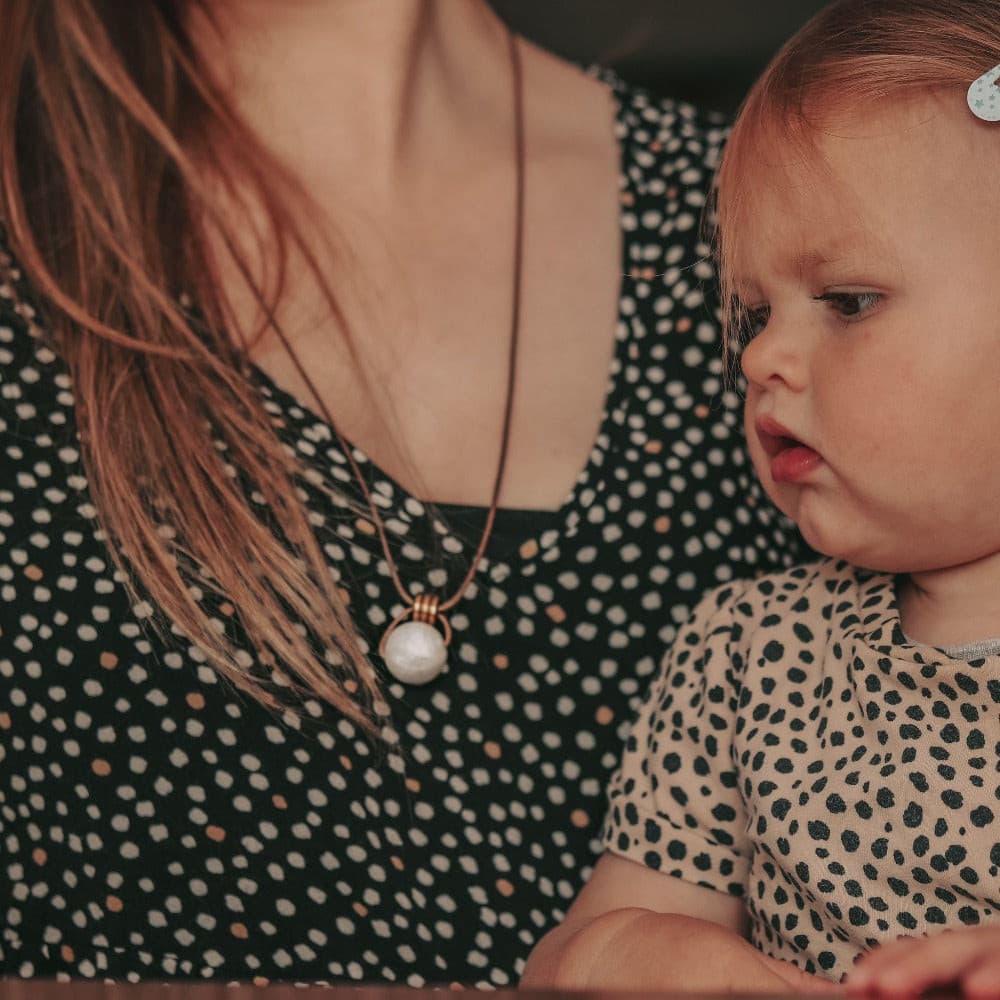 Antique Pearl breastfeeding and teething necklace ivory pearl white gold beads mum wearing necklace with baby