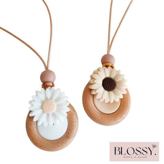 Daisy Bloom Pendant showing beige and white colour options - Blossy Breastfeeding, Teething and Fiddle Jewellery at its finest.