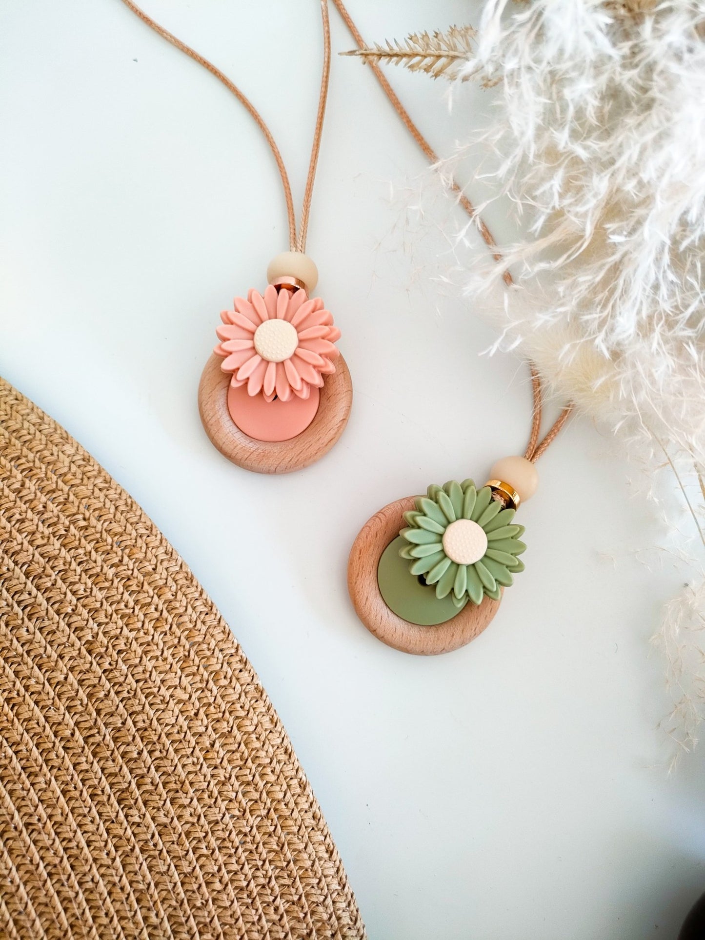 Daisy Bloom fiddle pendant in peach and sage green on white background