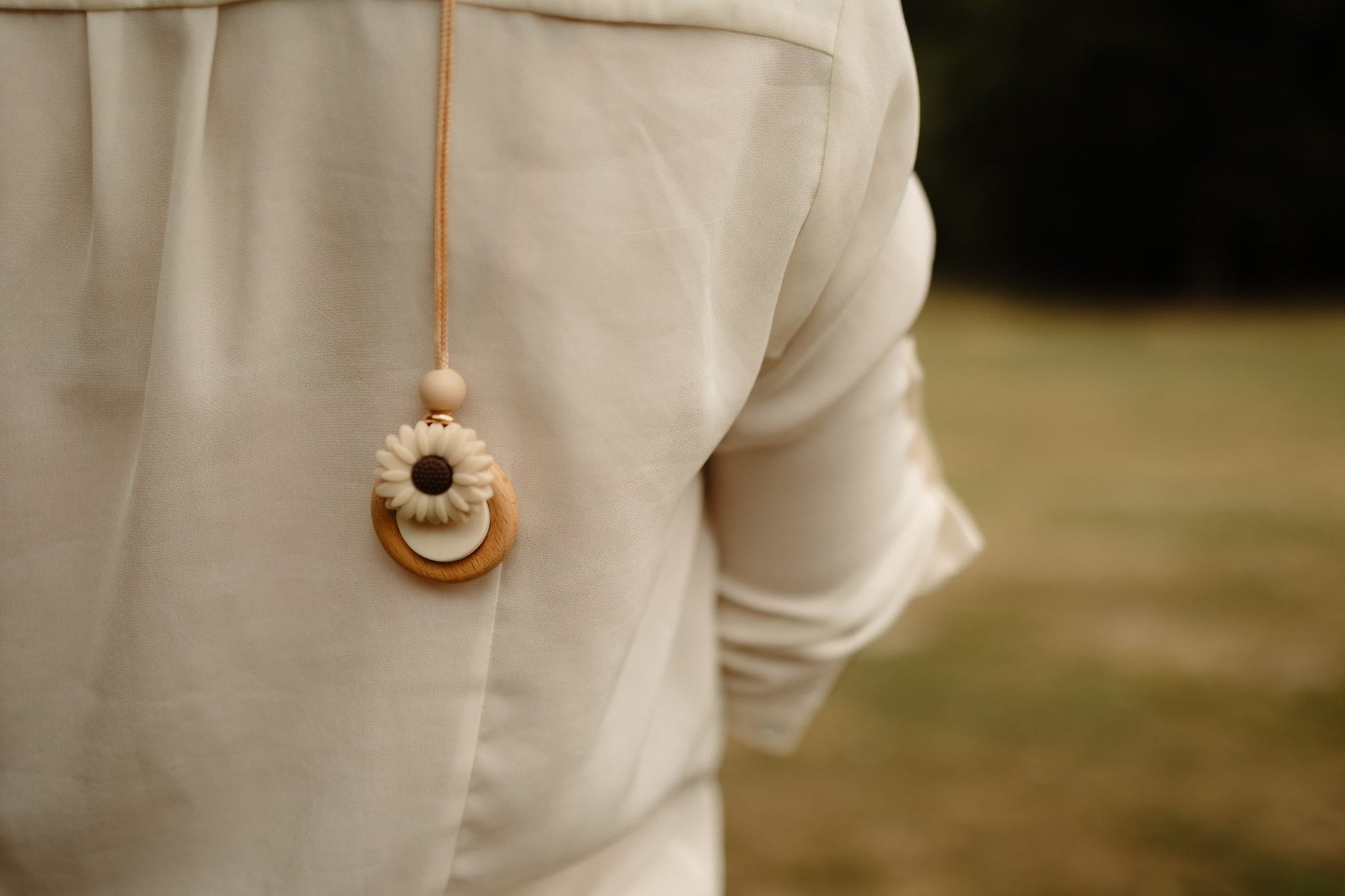 Daisy Bloom breastfeeding necklace worn by mum- Blossy