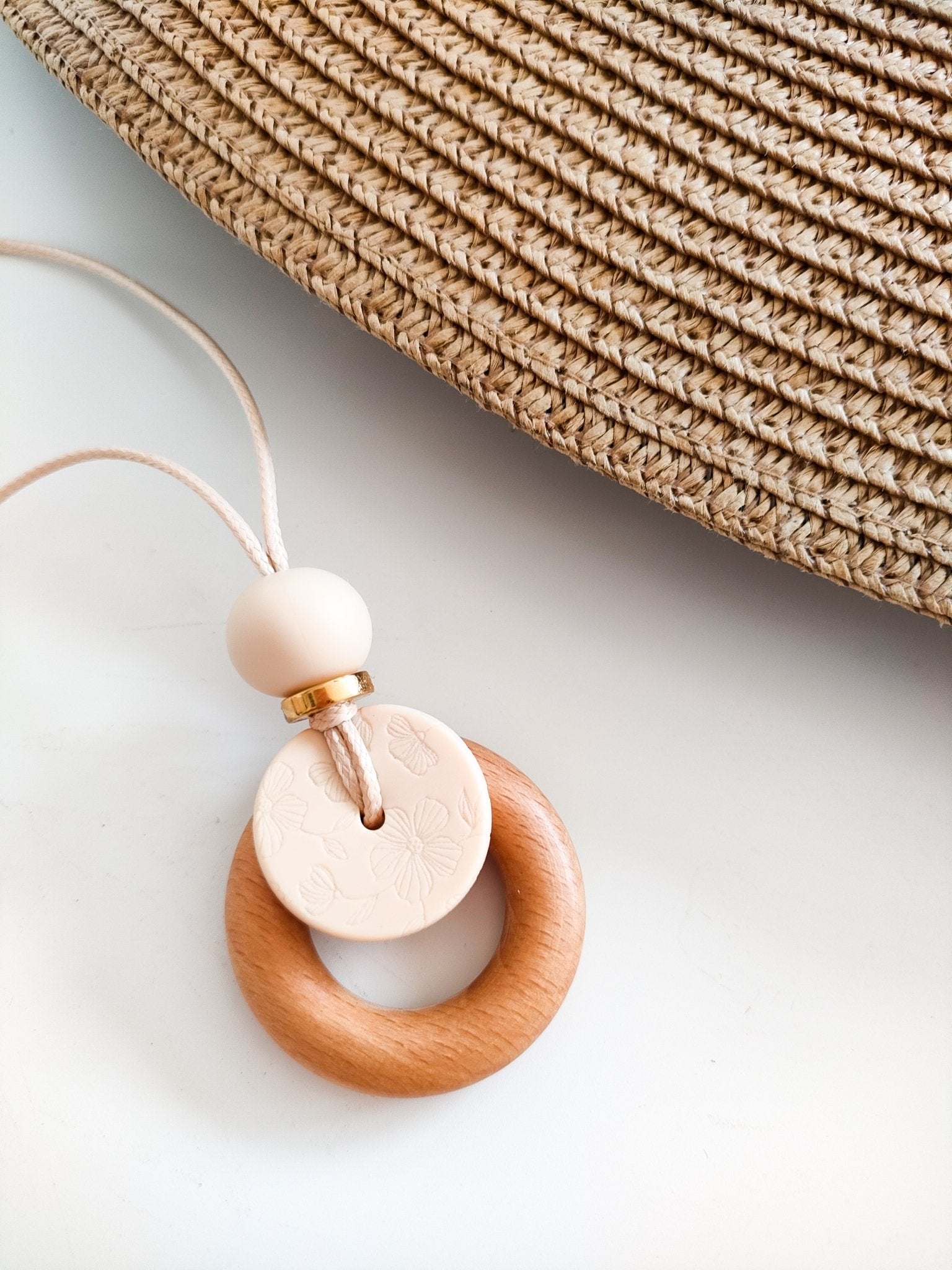Embossed Cream Bloom Pendant - Bennie Blooms Breastfeeding, Teething and Fiddle Jewellery at its finest.