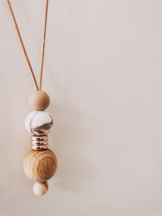 Nudes Blossom Weight necklace for mum to wear hanging on white background