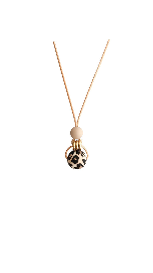 leopard Oatmeal nursing Pendant for feeding and teething on white background with gold detail