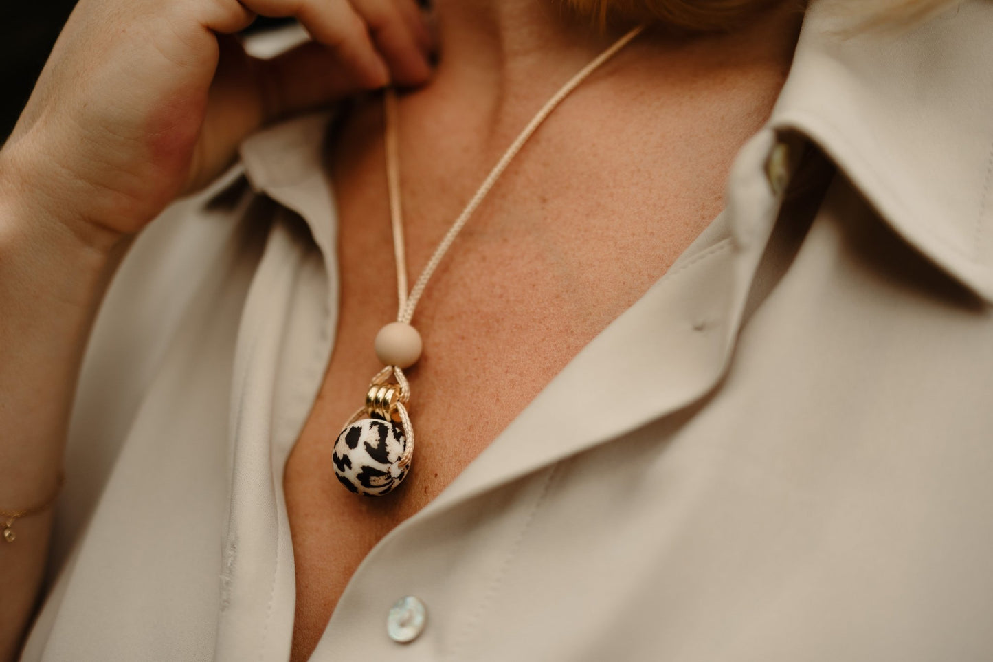 leopard Oatmeal Pendant worn by mum for fiddling.